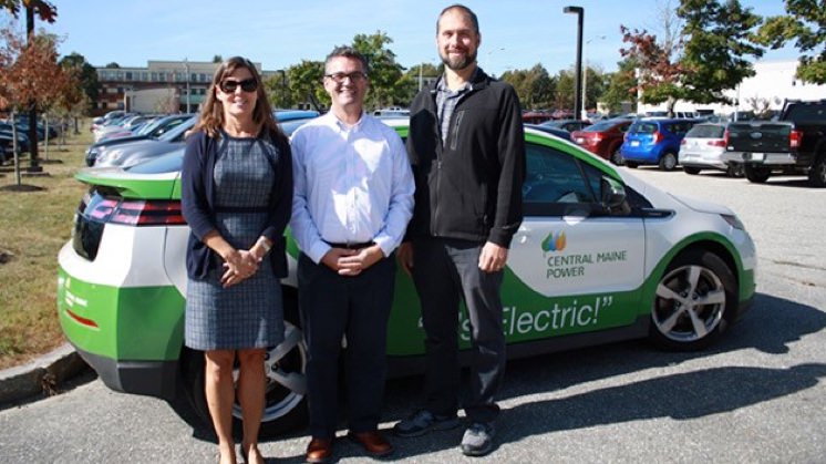 Jennifer Brennan of Greater Portland Council of Governments, Joel Harrington of Central Maine Power, and Mike Windsor of the Scarborough Public Library celebrate the latest awards from CMP's Electric Vehicle Grant Program.